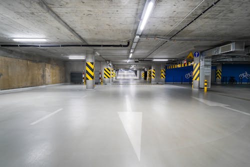 Road with White Arrow in Parking Garage