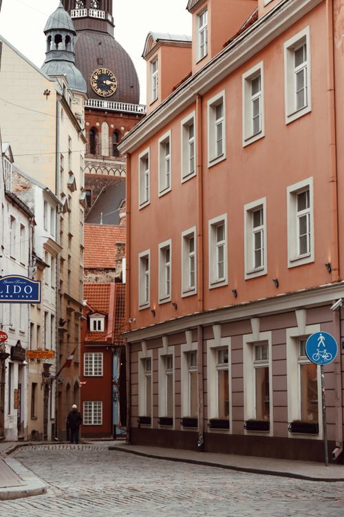 Free Explore a quaint street in Riga's old town, showcasing historic architecture and European charm. Stock Photo
