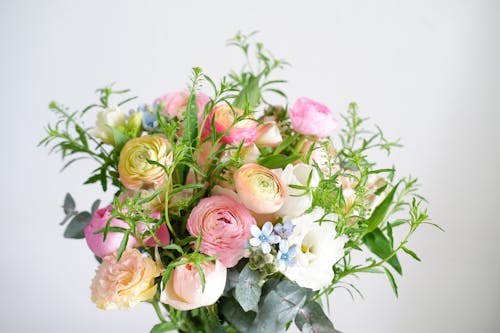 A bouquet of flowers in a vase on a table