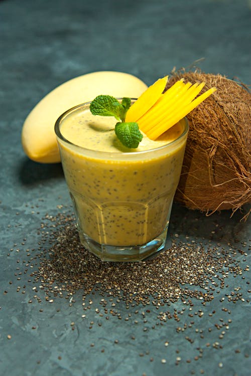 A smoothie with mango, coconut and mint