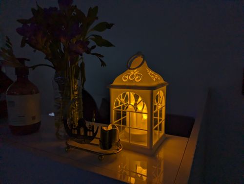 Free A warm, ambient lantern light in a dark room with Ramadan decoration, creating a cozy atmosphere. Stock Photo