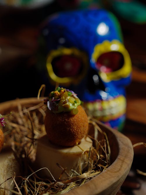 A bowl of food with a skull on top