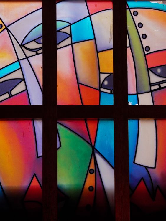 Free Vibrant abstract stained glass window design with modern art style and bold colors. Stock Photo