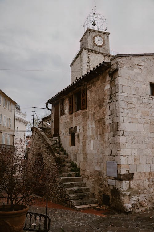 A church with a clock tower and stairs
