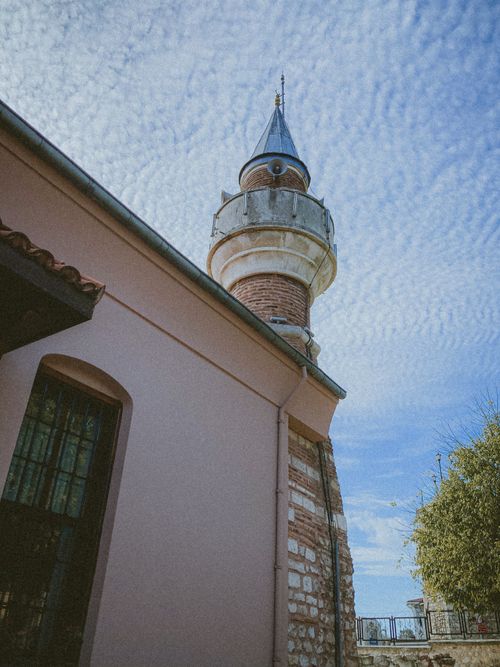 Free Low-angle shot of the Piri Mehmet Pasa Mosque minaret against a textured sky in Istanbul. Stock Photo