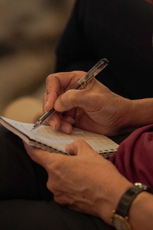 Man Hands Writing in Notepad · Free Stock Photo
