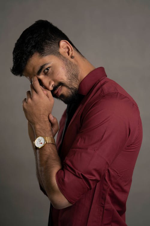 Portrait of Man in Red Shirt and with Wristwatch