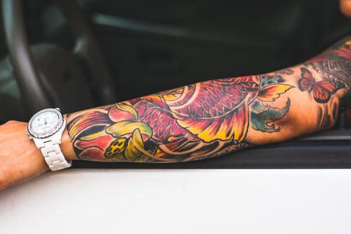 Photo Of Left Arm With Tattoo Free Stock Photo photo-of-left-arm-with-tattoo-free-stock-photo