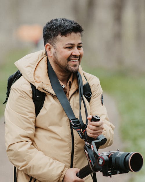 A man with a camera and a backpack