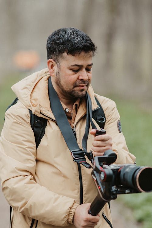 A man holding a camera and holding a camera