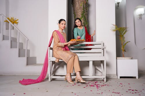 Young Women Posing in Traditional, Elegant Clothing 