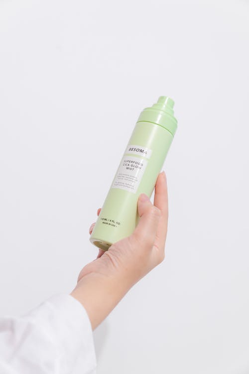 Hand model holding spray bottle