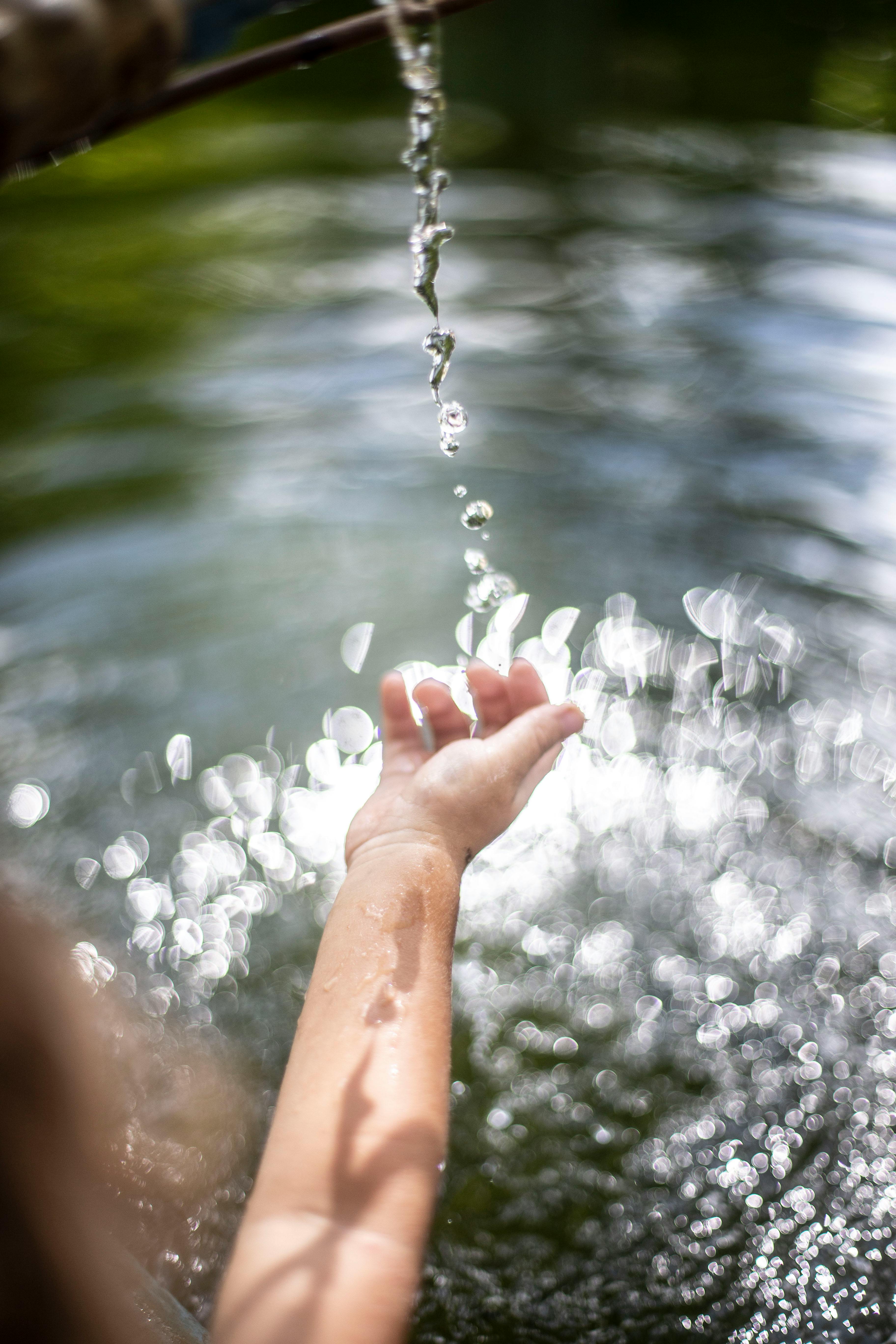 Person Splashing Water · Free Stock Photo