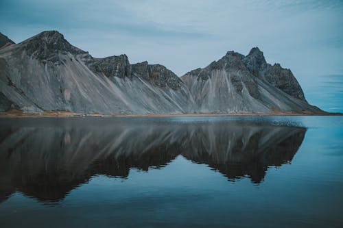 Mountains reflected in a lake at dusk