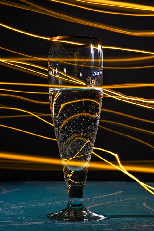 A glass of champagne with light streaks
