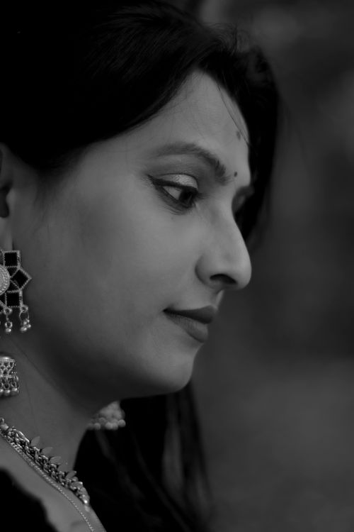 Free Black and white close-up portrait of a woman with traditional jewelry in Maheshtala, WB, India. Stock Photo
