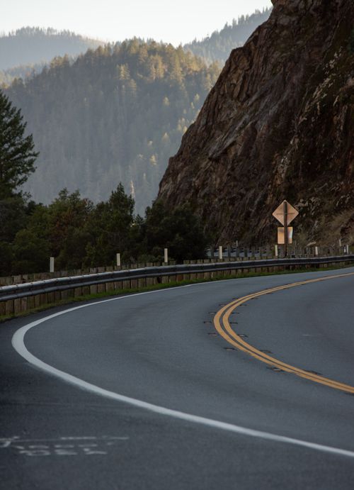 Free A winding road through the scenic mountainous landscape of Big Bar, California, USA. Stock Photo