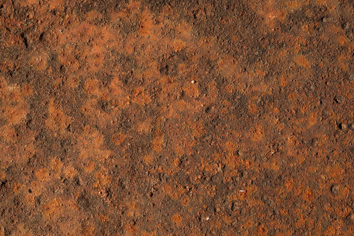 A rusty texture with some dirt on it
