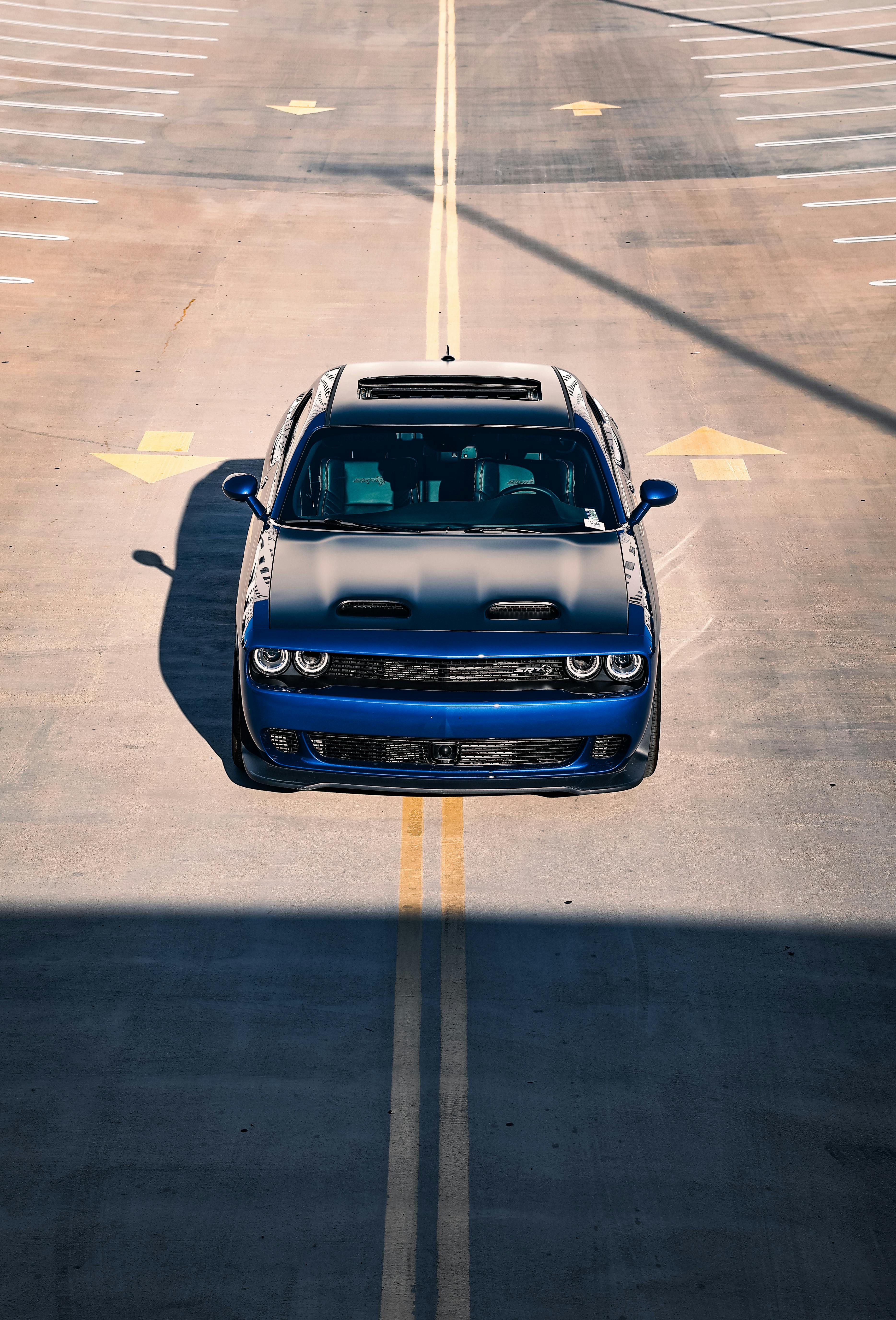 blue car on an asphalt