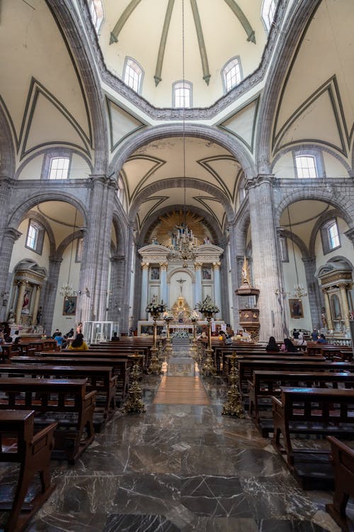 The interior of a church with a large dome