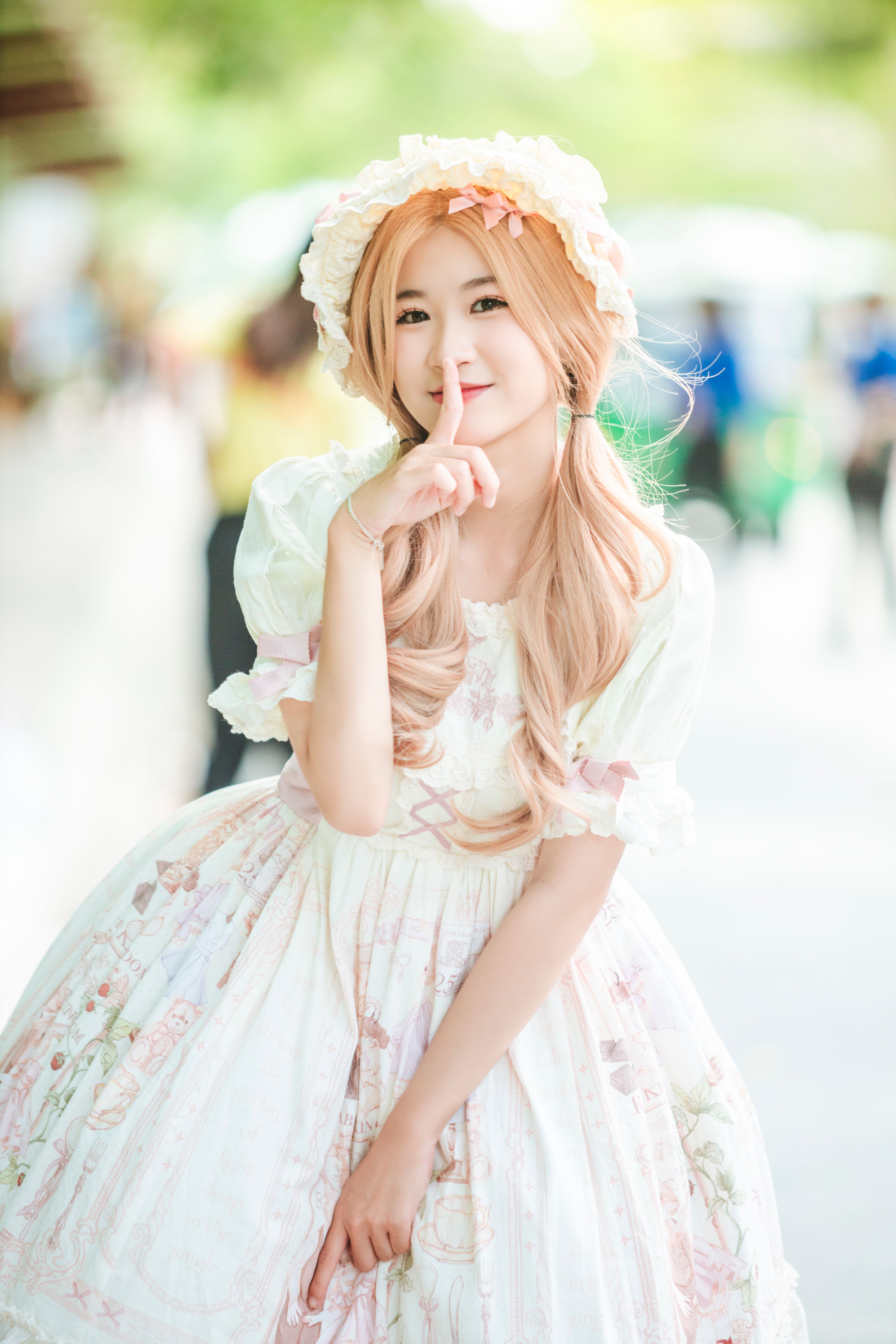 Young Girl in a White Dress Standing Outside · Free Stock Photo