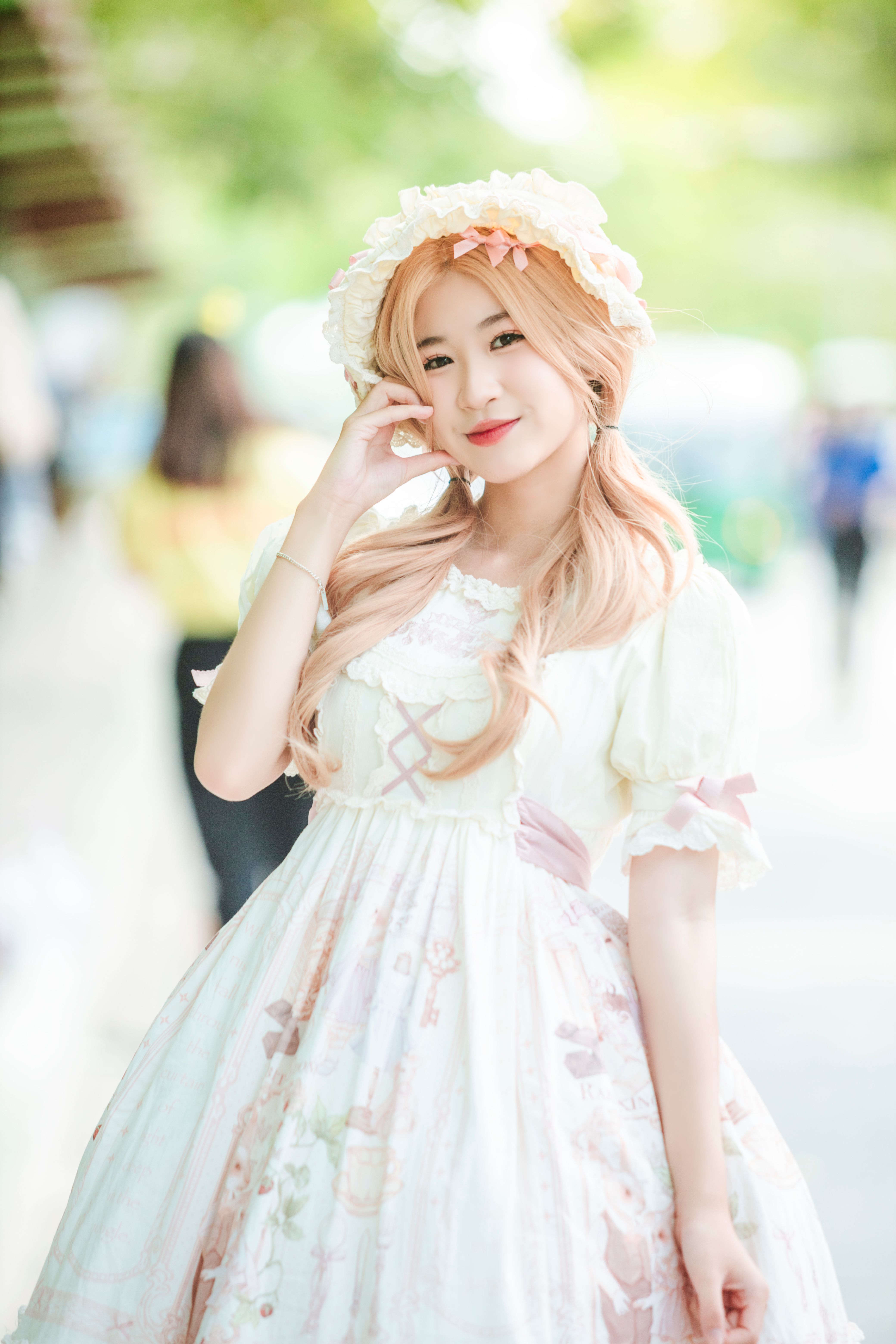 Young Girl in a White Dress Standing Outside · Free Stock Photo