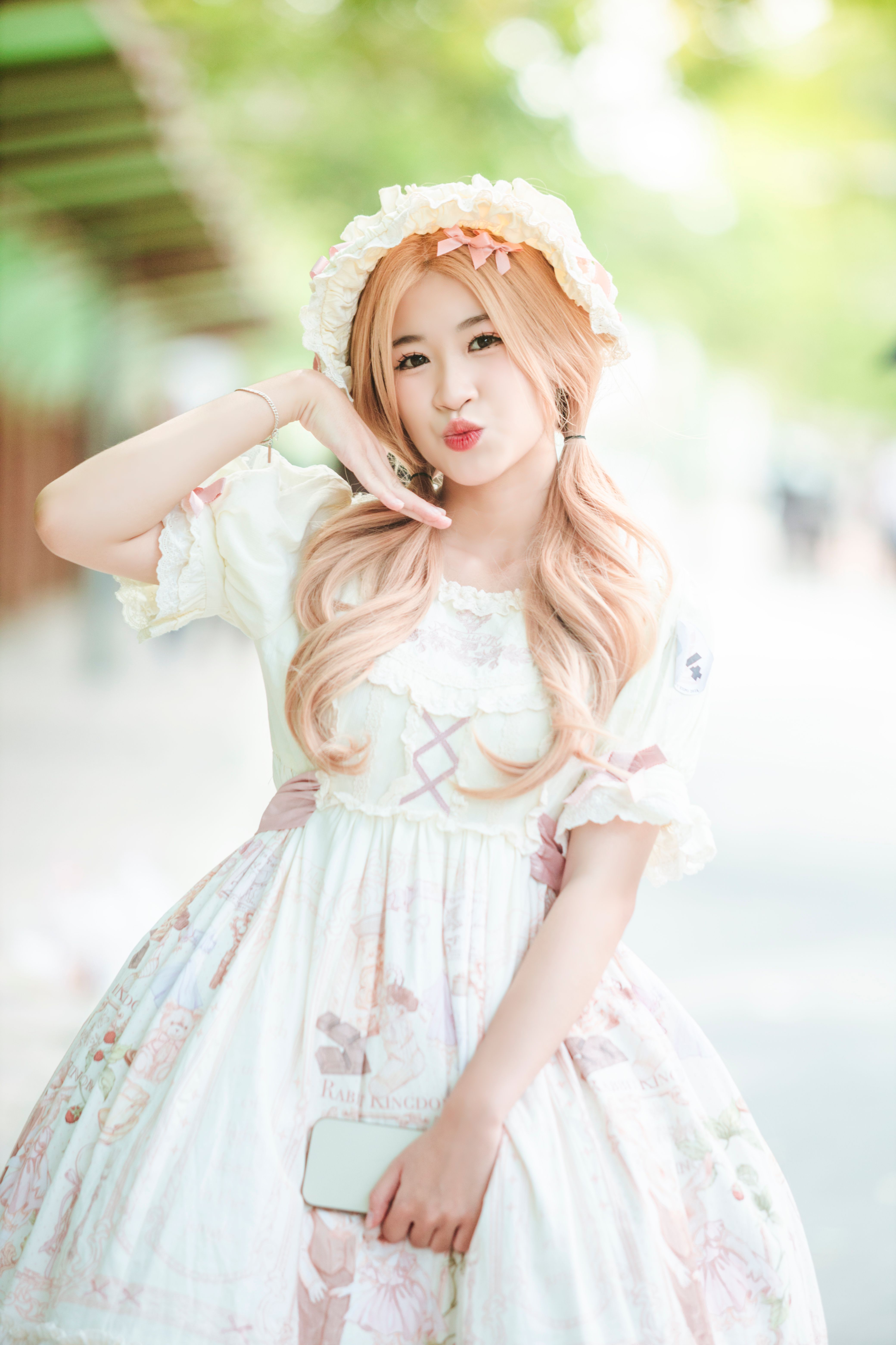 Young Girl in a White Dress Standing Outside · Free Stock Photo