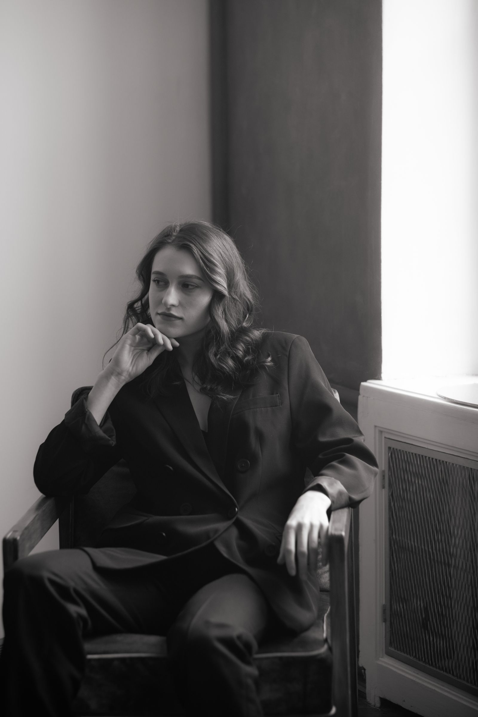Woman in Black Coat Sitting on Chair · Free Stock Photo