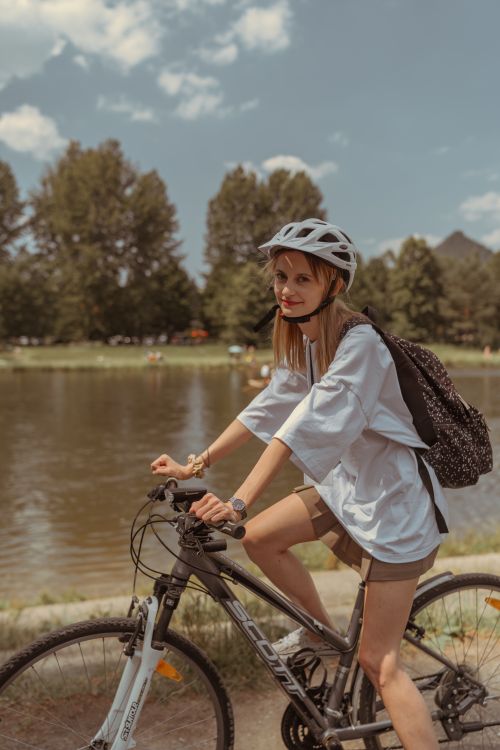 Free Explore the beauty of Sromowce Niżne, Poland with a woman cycling by the riverside. Stock Photo