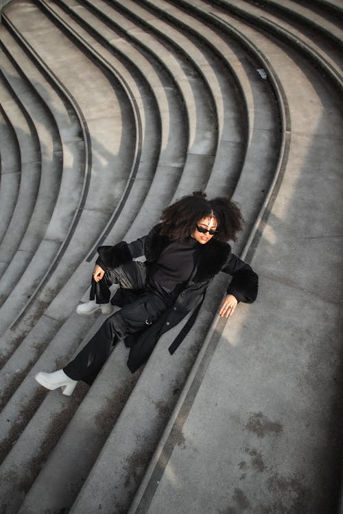 Woman Wearing Black Clothes Posing on Stairs 