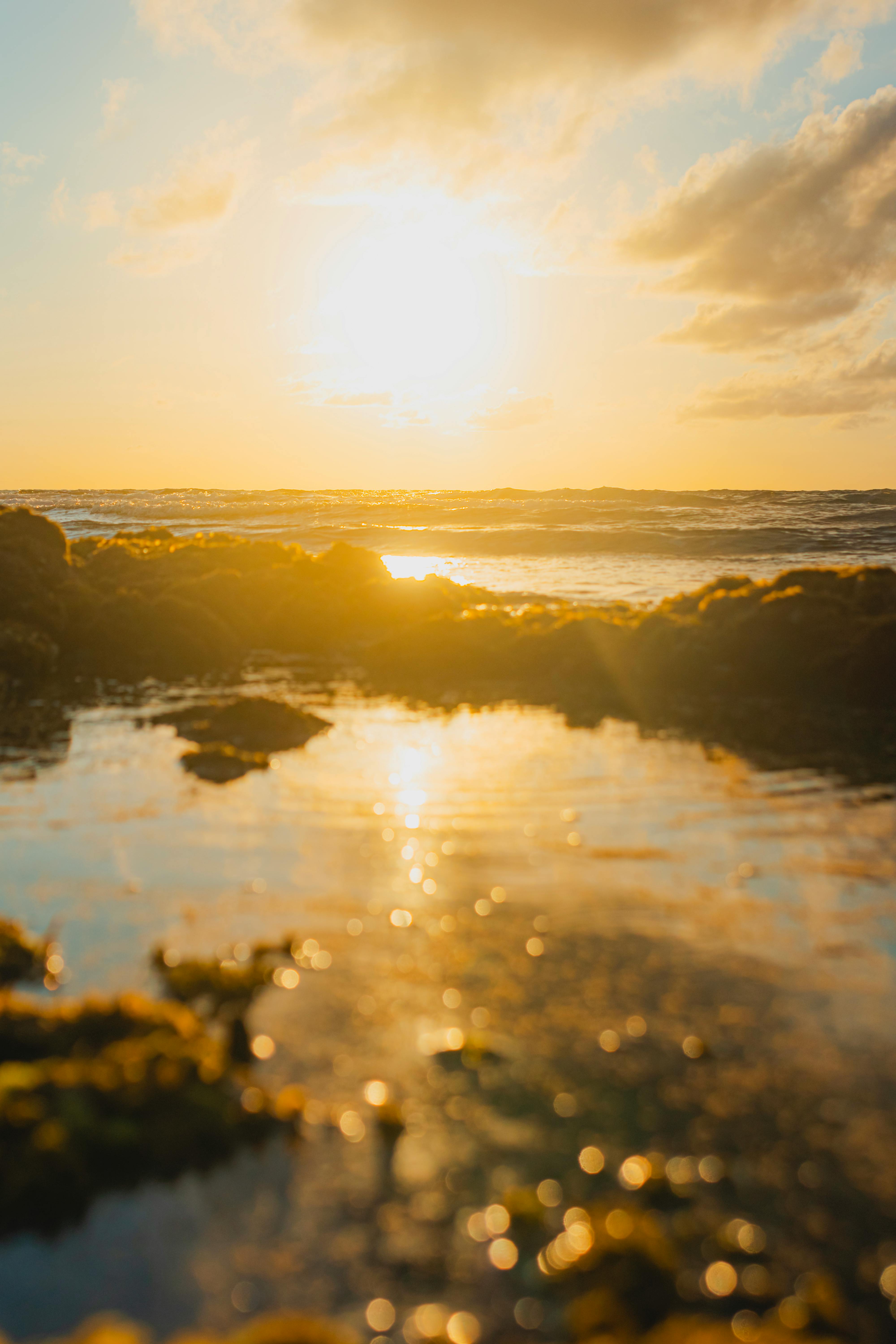 Natural tide pool at Tegal Wangi Beach in Jimbaran Bali during golden hour, one of the easiest hidden beaches to reach