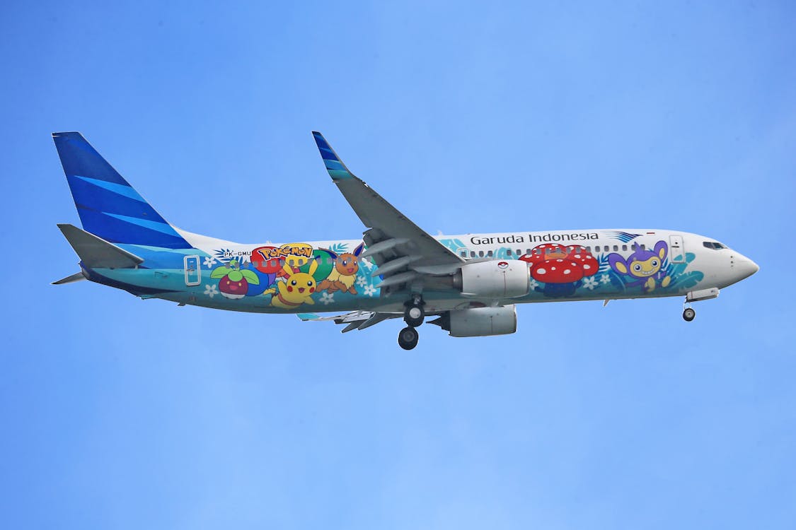 Free Pokemon Design of Flying Garuda Indonesia Airplane Stock Photo