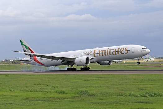 Emirates Airlines aircraft taking off on a cloudy day, showcasing aviation majesty.