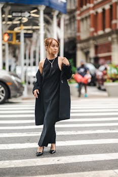 Chic urban fashion portrait of a woman crossing the street in New York City.