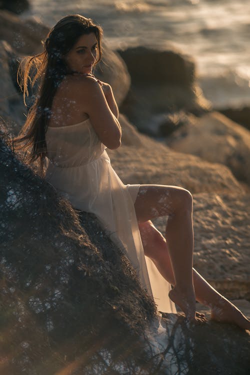 Free Woman Leaning On Rock Stock Photo