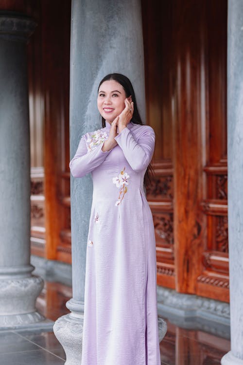 Smiling Woman in Traditional, Purple Dress
