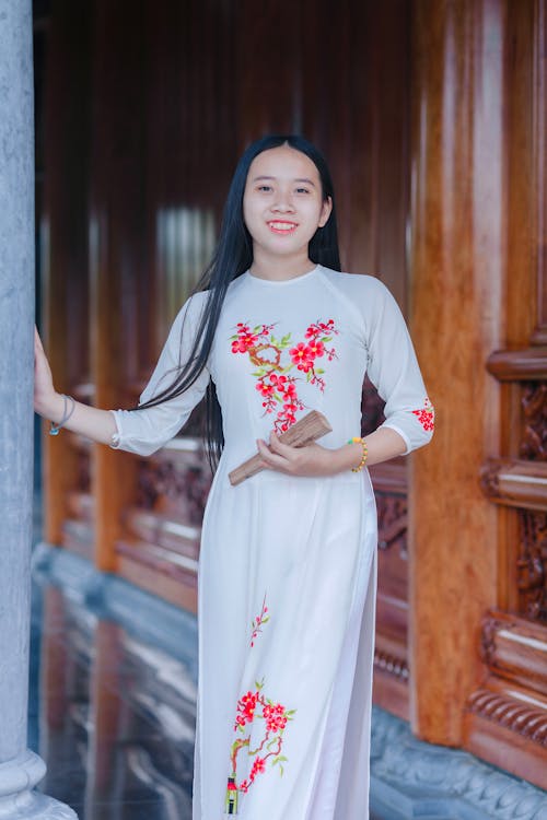 Smiling Woman in White, Traditional Dress