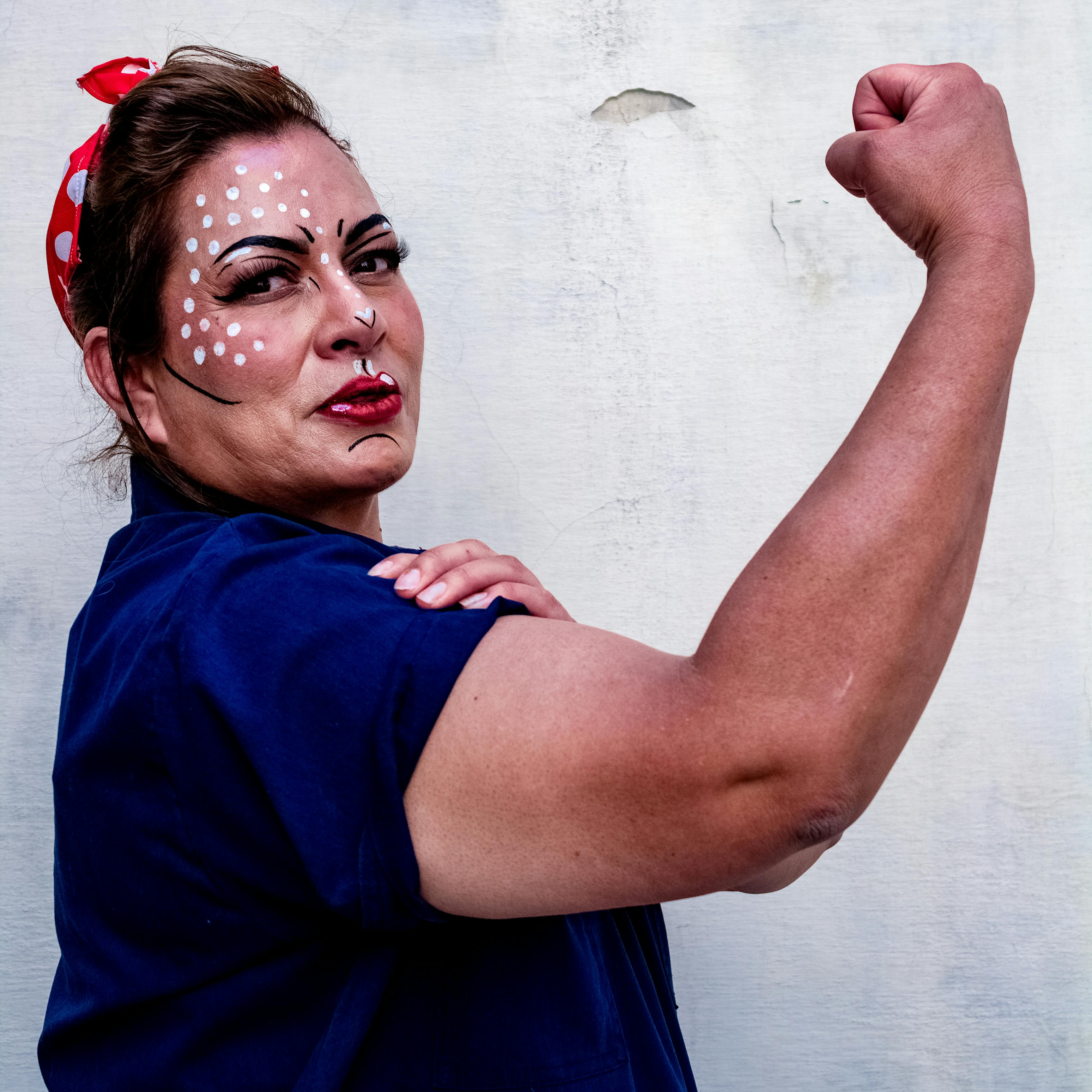 Portrait of Woman Showing Muscle