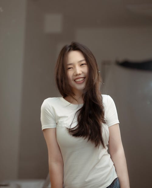 Smiling Woman in White T-shirt