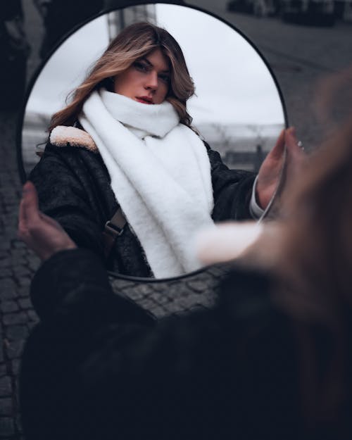 Blonde Woman in Scarf Holding Mirror