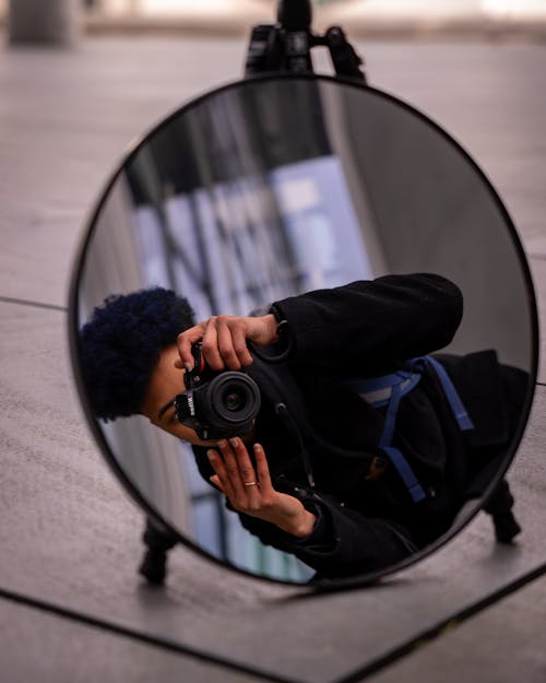 A person taking a picture in a mirror