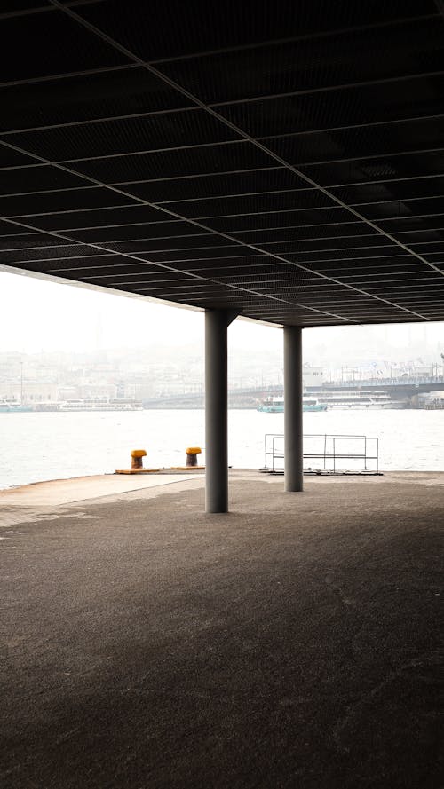 A view of the water from under a bridge