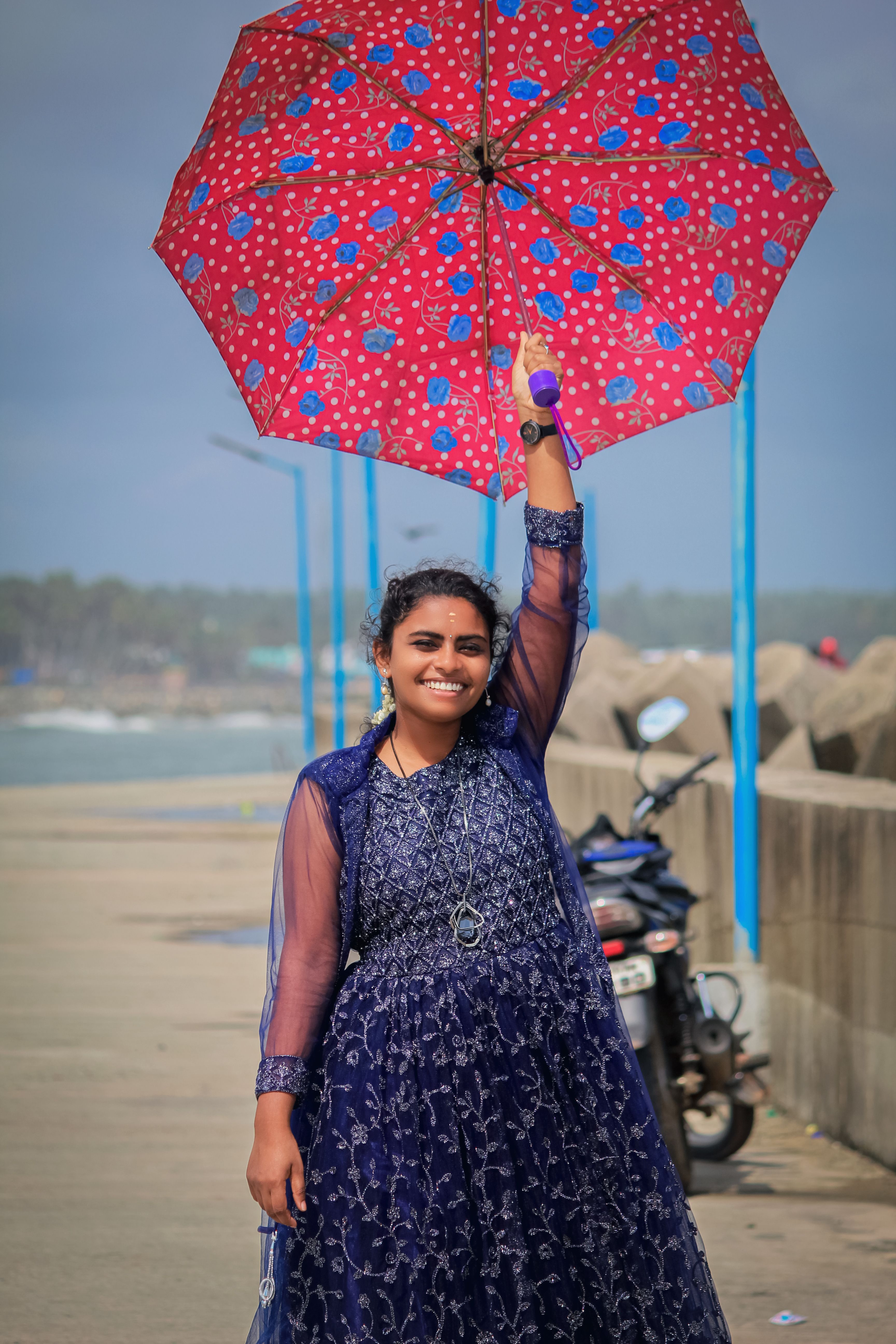 Happy Woman in a Dress Holding an Umbrella · Free Stock Photo