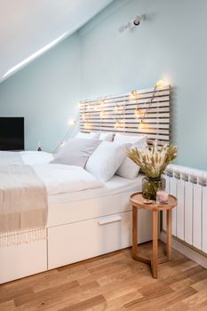 Modern bedroom with stylish decor and soft lighting, perfect for creating a relaxing atmosphere.