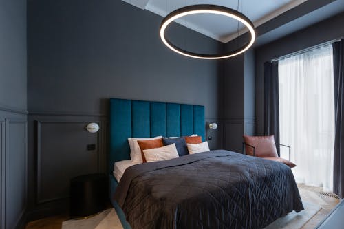 Interior of a Modern Bedroom with Dark Walls 