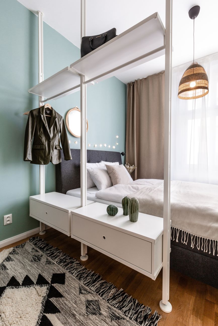 Compact elegant apartment bedroom with antique desk