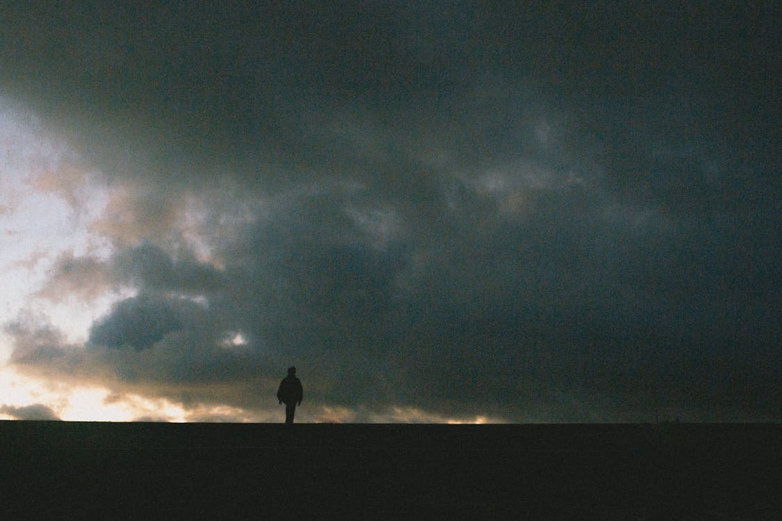 Silhouette of Person Standing · Free Stock Photo