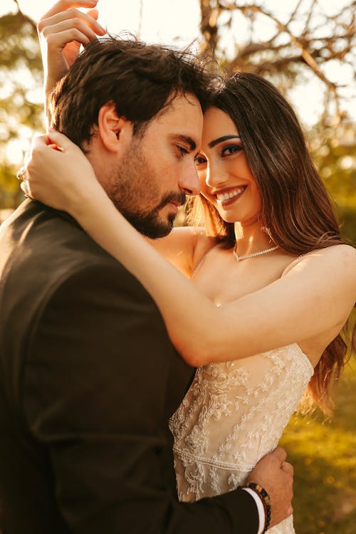 Bride and Groom Embracing and Smiling 