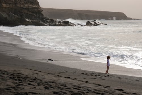 Girl on Beach on Sea Coast