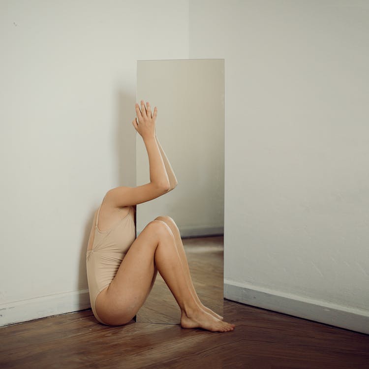 Free Woman Behind a Mirror in a Room  Stock Photo